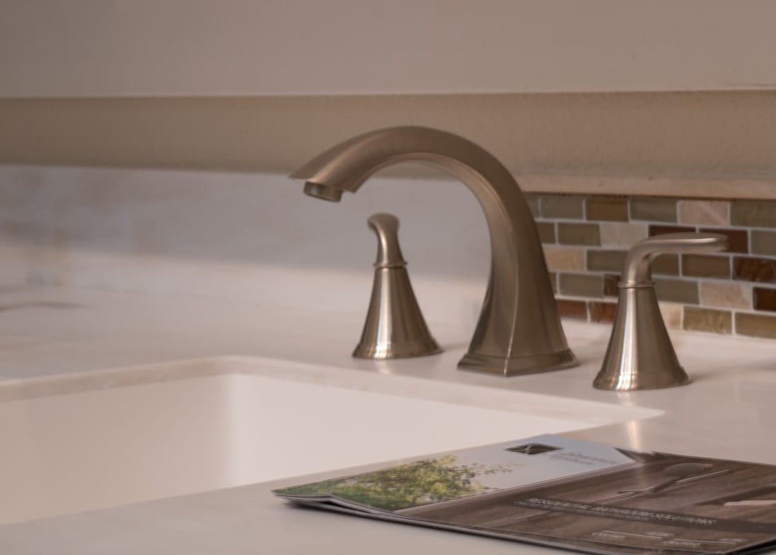 Close-up of sink faucet with Signature Surfaces countertop
